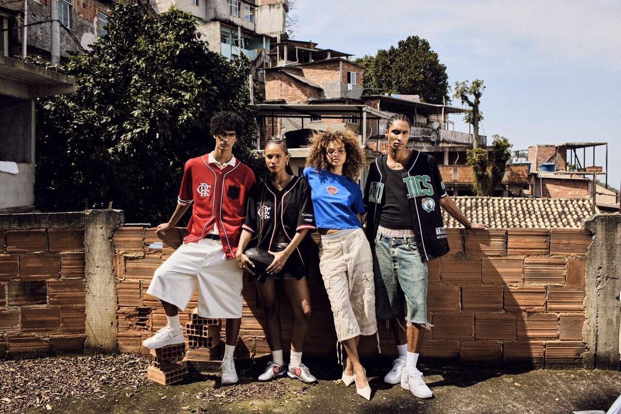 ProStandard NFL × Flamengo campaign, four models against a brick wall with the hillside behind